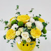 Sunny yellow roses and crisp white blooms tucked into a playful yellow