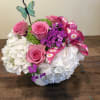 Assorted hydrangea with pink roses, dianthus and a butterfly