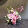 A bright pop of fresh flowers to brighten your day.

Measures approx. 17"T