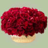 Luxurious asymmetric lush composition features red blooms. Every petal is perfectly reflexed