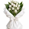 A bouquet of gorgeous white roses wrapped in white paper makes a