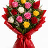 A bouquet of gorgeous pink white red and yellow roses wrapped in