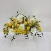 A bright mix of yellow spray roses and white chrysanthemums, and alstroemeria