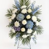 A graceful standing sympathy spray that brings calm and reverence to a