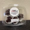 Plastic clamshell container of dark chocolate clusters