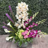 A lovely mix of fresh purple orchids with white hydrangeas with mixed