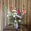 Layers of pink, white, and lavender blooms with touches of bright pink