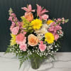 A soft, cheerful bouquet that brightens any spring celebration - this Designer