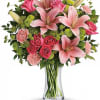 Large pink lilies and bright pink roses create an immediate wow-this flower