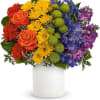 A bold, joy-filled arrangement that reads like a pocket-sized rainbow - perfect