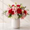 Radiant Romance is a luxurious, garden-style flower arrangement designed to make a
