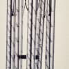 Hanging metal wind chime with silver tubes and an oval 