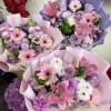 Florist, choice Pink and lavender bouquet mix of gerbera, roses, lilies and