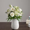 A serene all-white arrangement designed to comfort and celebrate-the ideal sympathy arrangement