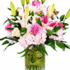 A beautiful blend of pink roses, lilies, and hydrangeas arranged in a