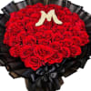 Large bouquet of red roses with a white floral letter M and black wrapping