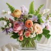 Mixed pastel bouquet in a clear glass vase