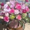 Beautiful hat box arrangement, styled in floral foam.  Orchids, garden roses
