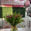 20 tulips in a vase .  Due to high demand We