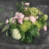 Pink roses and green chrysanthemums in a green vase