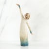This porcelain-style decorative figurine captures a serene, elongated woman in a long