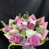 Soft blush peonies and bright pink roses steal the show in this