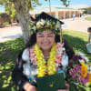 A bright cascade of double orchid leis makes a memorable graduation gift