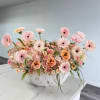 Elevate any space with this luxurious, low-profile centerpiece that radiates warmth and