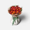 A striking, full-bodied bouquet featuring rich red roses, vibrant orange booms, and