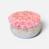 A delicate arrangement of premium preserved blush, pink roses, thoughtfully, arranged in