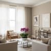 Potted purple orchids on a coffee table in a modern living room