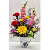 Colorful mixed bouquet in a white mug vase