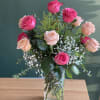 Pink roses with baby&rsquo;s breaths &amp; mix greenery
Arranged in glass vase 