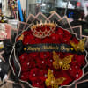 60 red roses topped with a royal crown, diamond pins &amp; gold