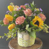 Bouquet of pink roses and yellow tulips in a decorative ceramic vase