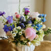 A soft, garden-style Mother&rsquo;s Day vase arrangement with locally grown blooms in