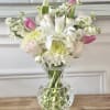 Pink and white mixed bouquet in a clear glass vase