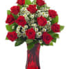 The perfect design of roses with white filler flowers accented with deep