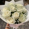 A classic bouquet of 12 fresh roses, beautifully arranged to express love