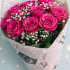 Vibrant hot pink roses (12 stems) beautifully arranged with delicate baby&rsquo;s breath