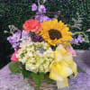 A fun, medium sized basket with all the spring/summer colors! Sure to
