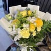 Radiate warmth and joy with this elegantly wrapped arrangement. Designed to mimic