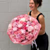 A statement bouquet built around lush garden roses and full peonies in