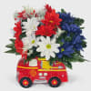Ceramic Firetruck with silk flowers that will last a lifetime. Great gift