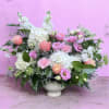 There&rsquo;s arrangement has hydrangeas, roses, carnations, Misty, lisianthus and different types of