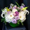 Soft and pale pinks, lavanders with whites are showcased in this 8'
