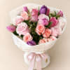 Designed with a curated selection of seasonal blooms, including tulips and fresh