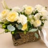 Luxury garden-style floral arrangement featuring cream roses, white carnations, eucalyptus, hypericum berries