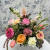 Our most popular arrangement ever, this vibrant spring garden-style design is made