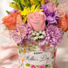 A soft pink rose takes center stage in this cheerful Mother's Day